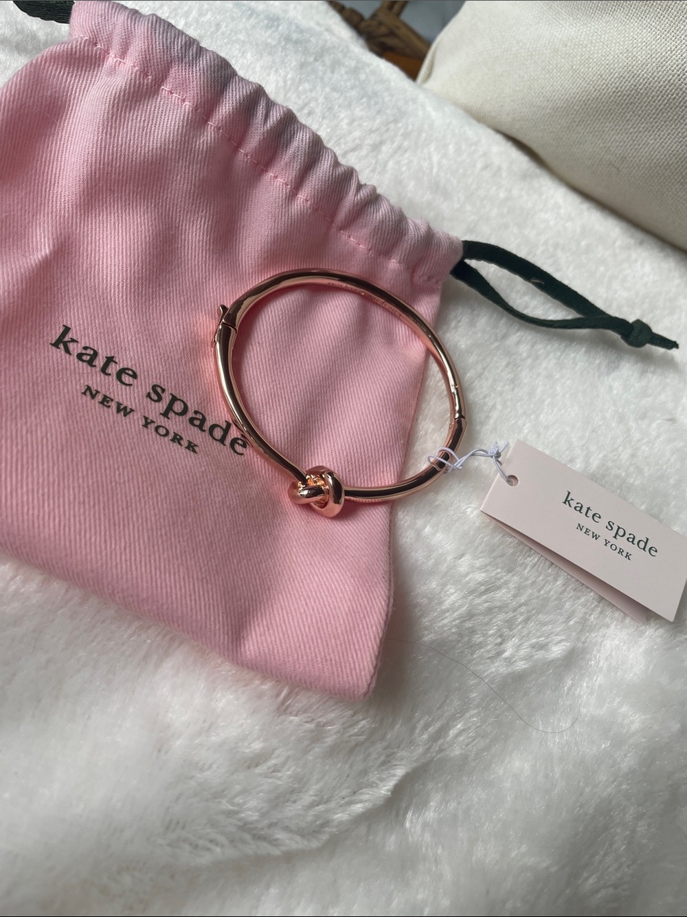 kate spade rose gold knot bangle with pink pouch